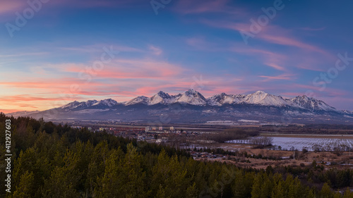 sunset over the sub-Tatra town of Svit with the river Poprad