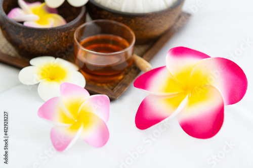 Set of spa treatments  natural oil  and plumeria flowers