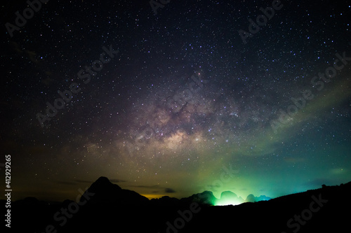 Amazing night sky. Scene of Night Starry Sky With Glowing Stars. Bright Glow Of Planets Saturn and Jupiter In Sky Among The Milky Way Galaxy Stars. Dark Sky and star.  © BUDDEE