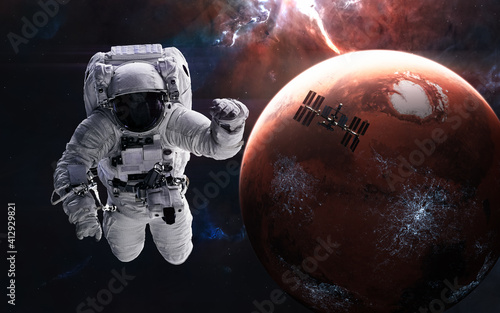 Mars. Astronaut, space station on background of inhabited red planet. Solar system. 3D render. Science fiction. Elements of this image furnished by NASA