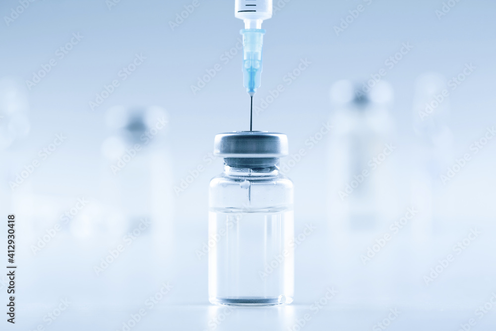 Medical syringe with a needle and a bollte with vaccine. Medical syringe with a needle and a bollte with vaccine.
