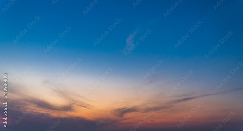 Colorful sunset sky in the evening on twilight with sunlight clouds, dusk sky background. 