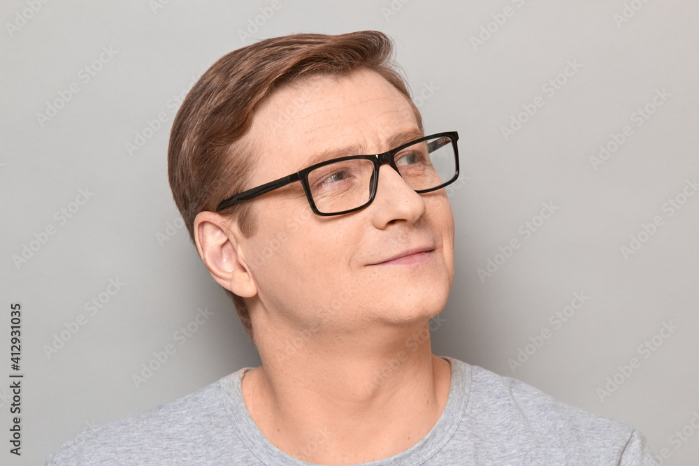 Portrait of happy blond mature man with glasses smiling cheerfully Portrait of happy blond mature man with glasses smiling cheerfully