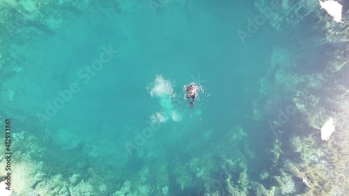 divers in the deep blue lake