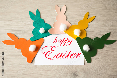 Easter rabbits on a wooden background. Banner. DIY holiday handicraft decorations. Concept: children's crafts for Easter. Top view. toned picture photo