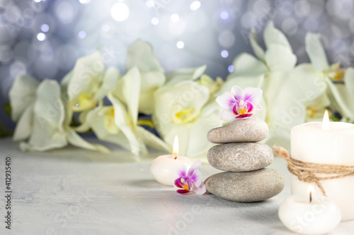Spa resort therapy composition. Stones  burning candles  towel  abstract lights