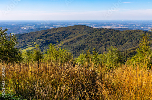 Fototapeta Naklejka Na Ścianę i Meble -  Panoramic view of northern Beskidy mountains with Gancarz peak seen from Leskowiec peak in Little Beskids mountains near Andrychow in Lesser Poland