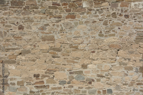 Castle wall made of old stones textures for design and photo background.