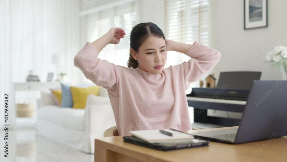 Attractive beautiful young asia female feel tired overworked negative impact health life stretching for break time relax stress relief in concept problem work remotely from home or burnout syndrome. Attractive beautiful young asia female feel tired overworked negative impact health life stretching for break time relax stress relief in concept problem work remotely from home or burnout syndrome.