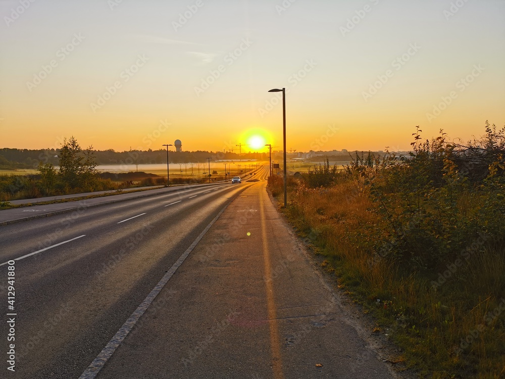 sunset over the road in sweden