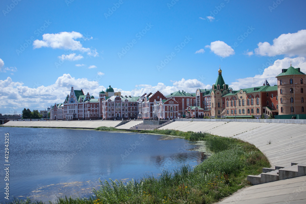 Colorful buildings on the river bank . Yoshkar-Ola. Russia