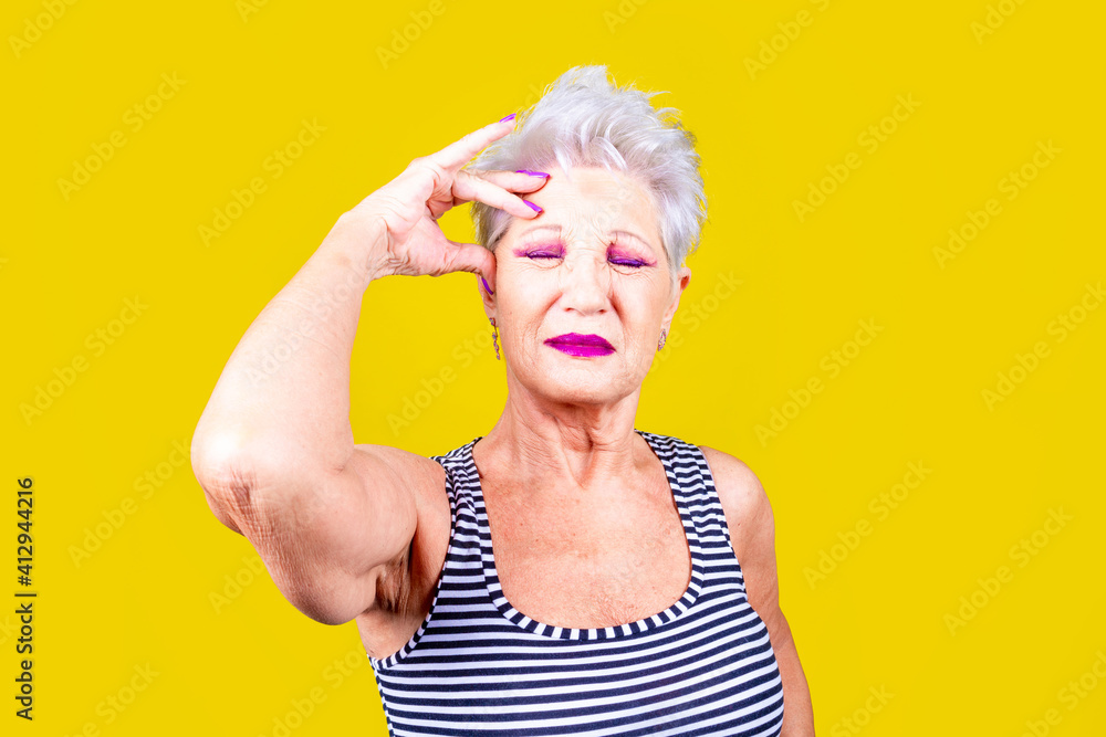 Old woman holding back having terrible headache Old woman holding back having terrible headache