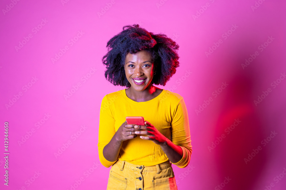 Young beautiful black woman texting smartphone Young beautiful black woman texting smartphone
