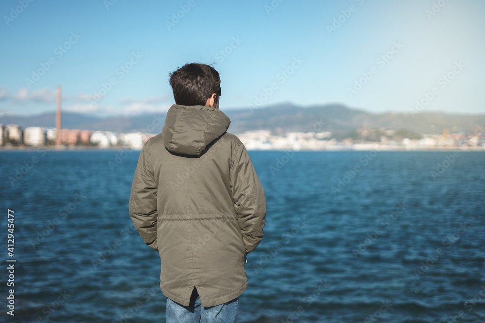 teenager looking at the sea teenager looking at the sea