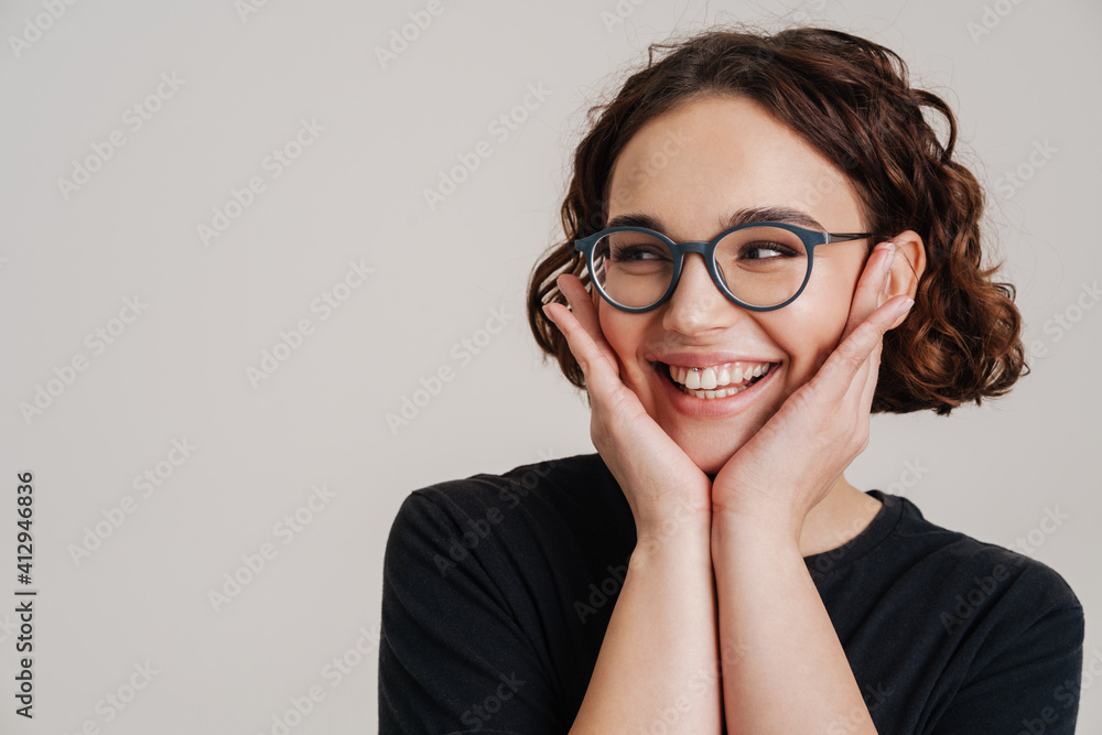 Happy smiling beautiful young woman presenting Happy smiling beautiful young woman presenting