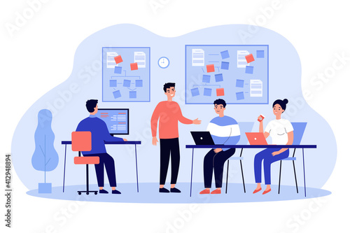Team of programmers developing software, working on app in office interior. Group leader or coach giving lesson to employees at note boards. For programming, coding, mentorship concept photo