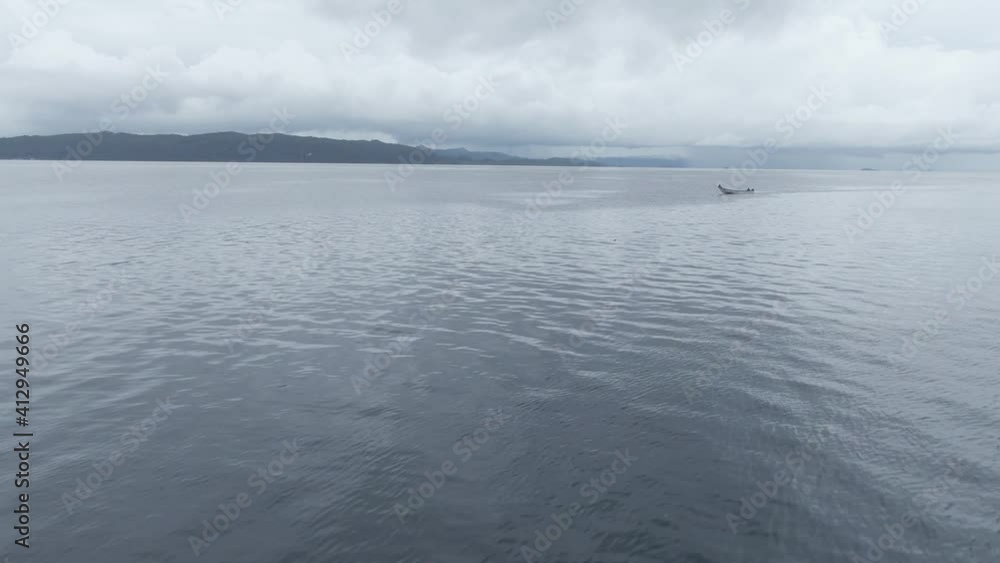 Aerial View Of Boat Splashing Water In Triton Bay In Kaimana Islands. Wide Angle Shot Of Ocean With Watercraft In Papua, Indonesia. Aerial View Of Boat Splashing Water In Triton Bay In Kaimana Islands. Wide Angle Shot Of Ocean With Watercraft In Papua, Indonesia.