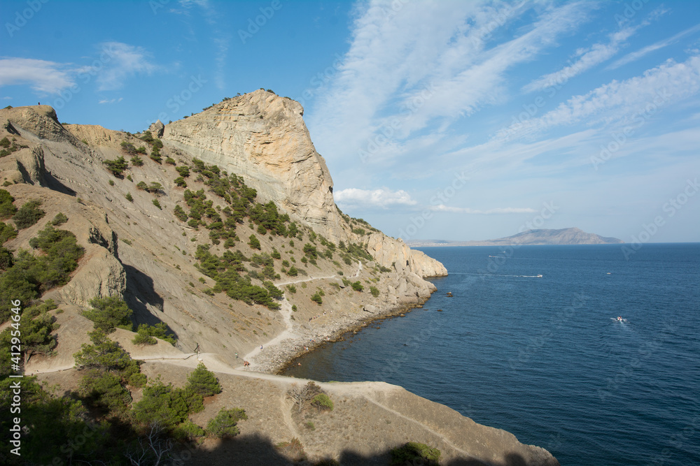 Summer Crimean landscape, juniper grove on a sunny day, Golitsyn Trail, Crimea.