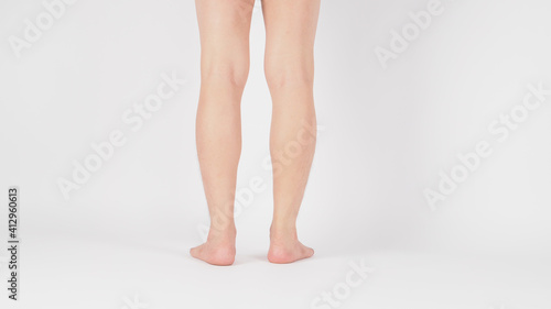 Back of Asian Male legs and barefoot is isolated on white background.