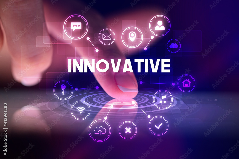 Finger touching tablet with web technology icons and INNOVATIVE inscription, web technology concept Finger touching tablet with web technology icons and INNOVATIVE inscription, web technology concept