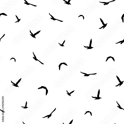 Seamless abstract pattern with black flying birds on white background.