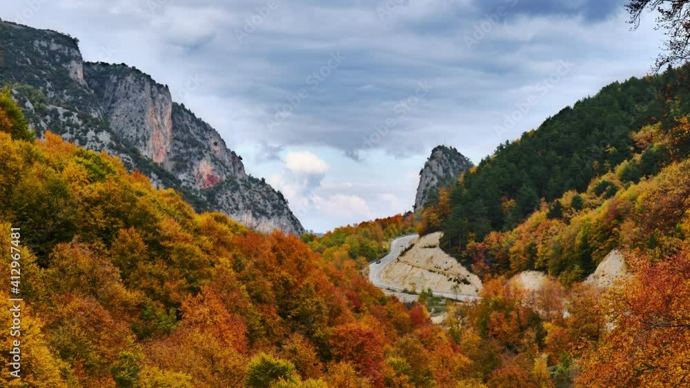 Cloud Timelapse on Orange Autumn Forest. Grey Clouds Passing Between the Mountains. Timelapse Shot in Forest. Idyllic and Beautiful Landscape of Forest on Fall Season. 4K Resolution. Cloud Timelapse on Orange Autumn Forest. Grey Clouds Passing Between the Mountains. Timelapse Shot in Forest. Idyllic and Beautiful Landscape of Forest on Fall Season. 4K Resolution.