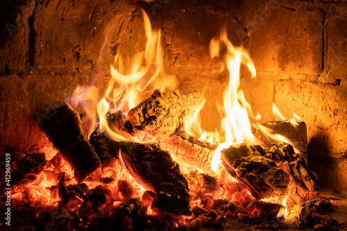 A fire burns in a fireplace  Fire to keep warm