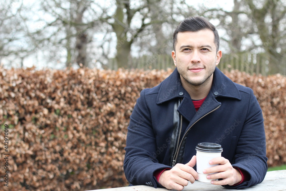 Hispanic businessman during coffee break in autumn Hispanic businessman during coffee break in autumn