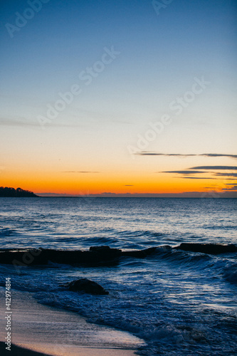 Sea waves water texture at sunrise