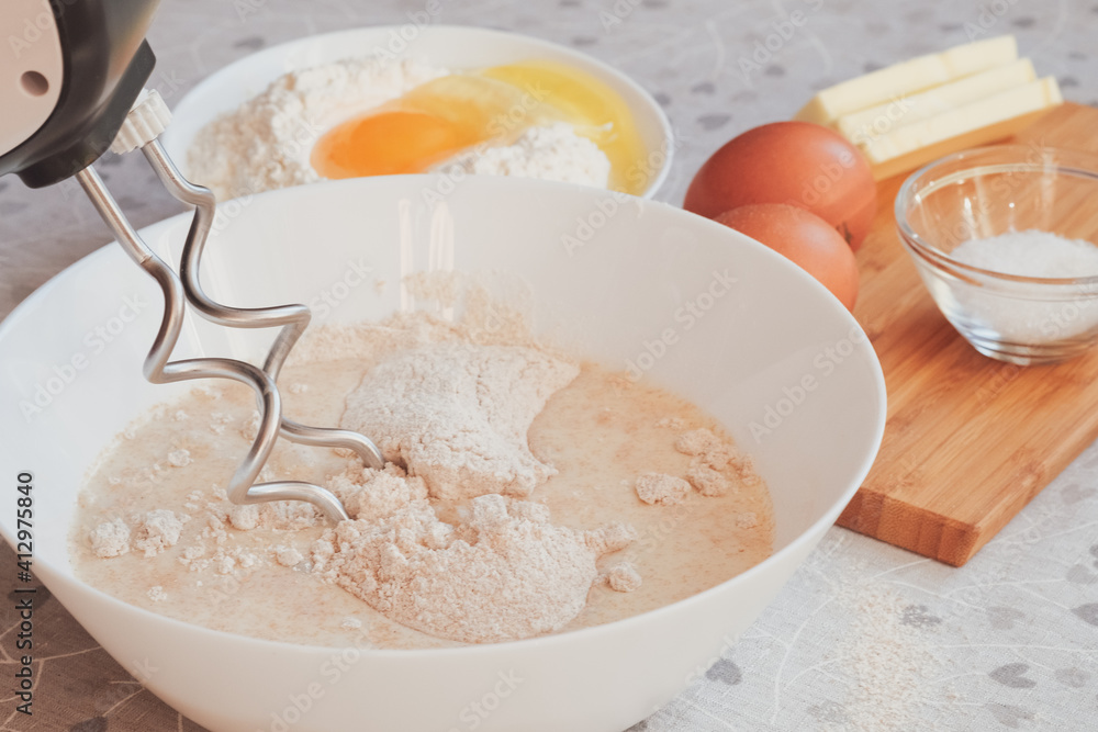 Mixer with dough for homemade pancakes. Breakfast for someone special concept. Top view, selective focus