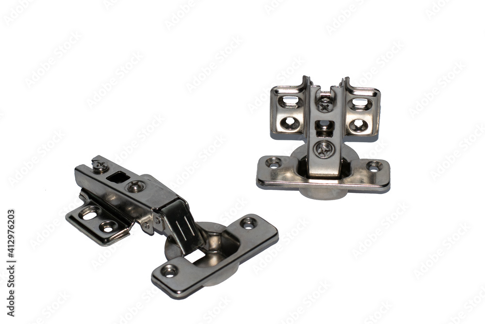 A pair of stainless steel concealed hinges for cabinet doors in a white background A pair of stainless steel concealed hinges for cabinet doors in a white background