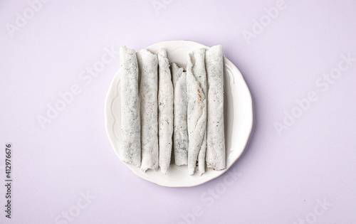 Til pitha a traditional food of Assam  isolated stock image. photo