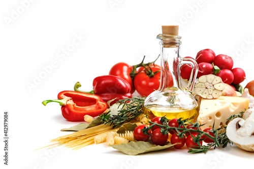 Italian food ingredients for making spaghetti pasta. Raw spaghetti with various ingredients. Isolate on a white background.