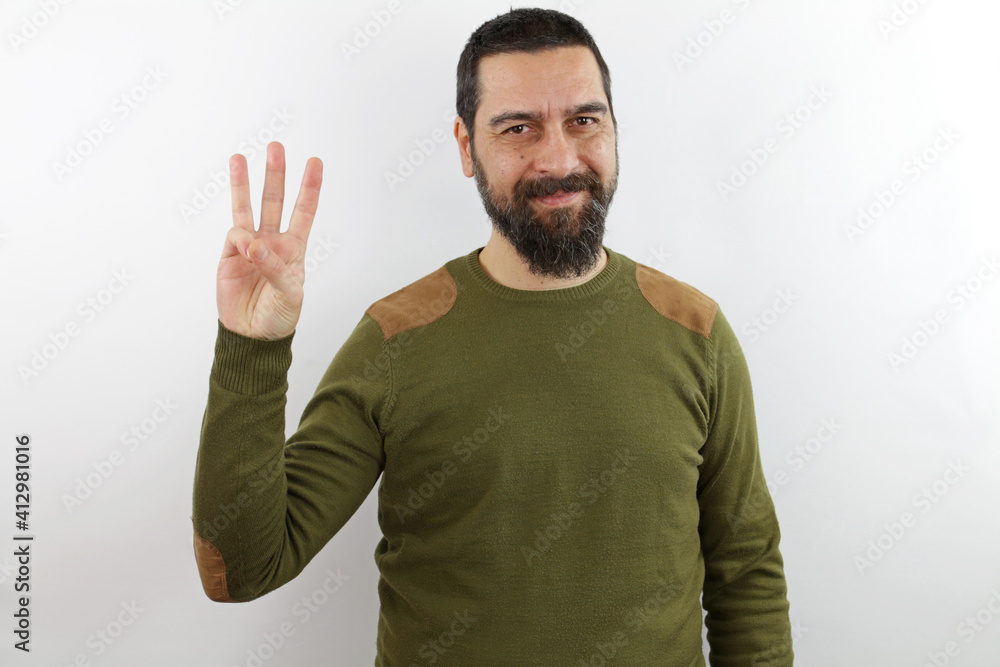 Bearded man wearing casual clothes showing and pointing up with fingers number three while smiling confident and happy. Bearded man wearing casual clothes showing and pointing up with fingers number three while smiling confident and happy.