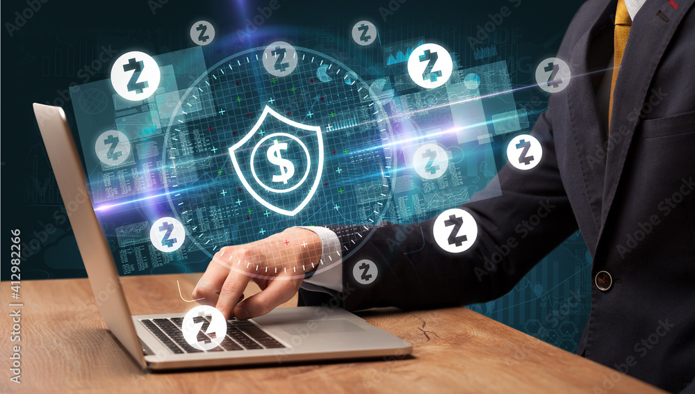 business hand working in stock market with dollar shield icons coming out from laptop screen business hand working in stock market with dollar shield icons coming out from laptop screen