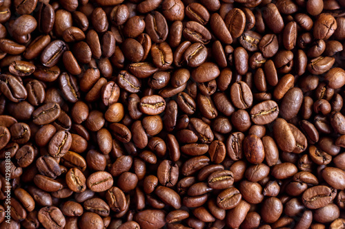 Roasted coffee beans background. Close up