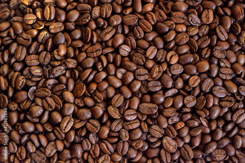 Roasted coffee beans background for design
