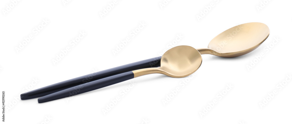 Elegant shiny golden spoons on white background Elegant shiny golden spoons on white background