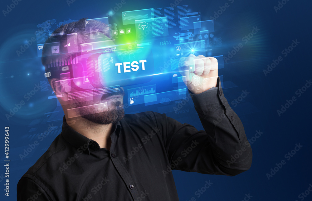 Businessman looking through Virtual Reality glasses with TEST inscription, innovative security concept Businessman looking through Virtual Reality glasses with TEST inscription, innovative security concept