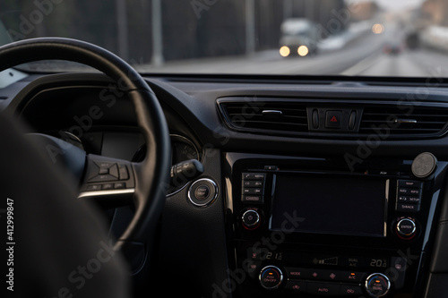 the dashboard of the car with a view of the road © I