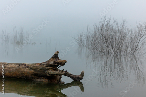 Bellus reservoir in a foggy day with reflections.