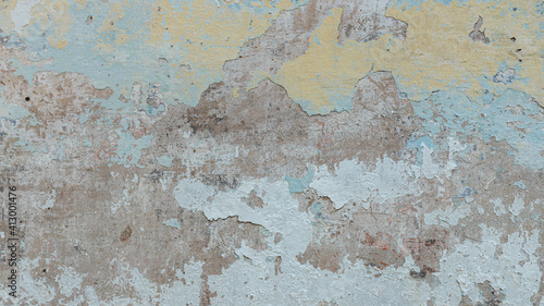Detail of a portion of the wall. Tears  hiding  graffiti  paint  concrete.