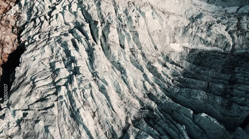 Aerial footage of the Swiss Trift Glacier in the alps photo