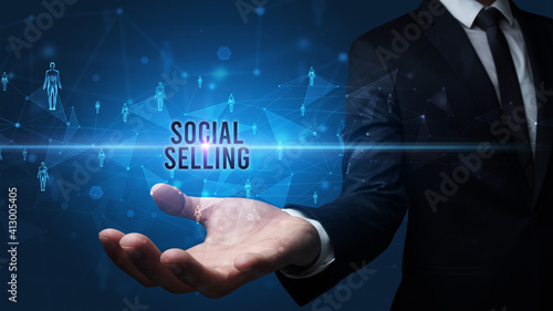 Wallpaper Mural Elegant hand holding SOCIAL SELLING inscription, social networking concept Torontodigital.ca