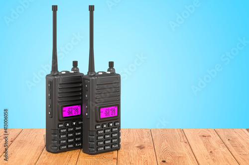 Portable radios walkie-talkie on the wooden planks, 3D rendering