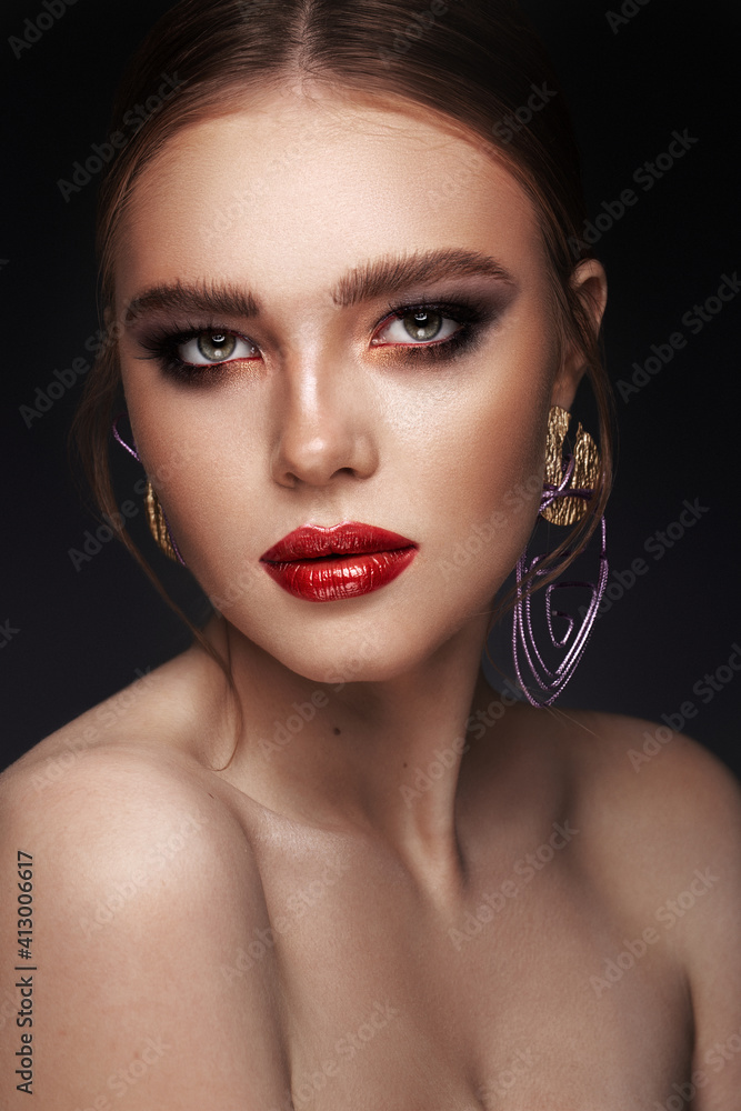 Beautiful girl with bright fashionable make-up and unusual purple accessories. Beauty face. Beautiful girl with bright fashionable make-up and unusual purple accessories. Beauty face.