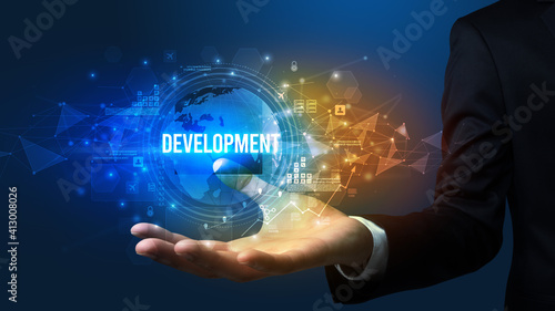 Elegant hand holding DEVELOPMENT inscription, digital technology concept