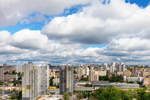 Dramatic beautiful sky with thick clouds over residential areas of the city.