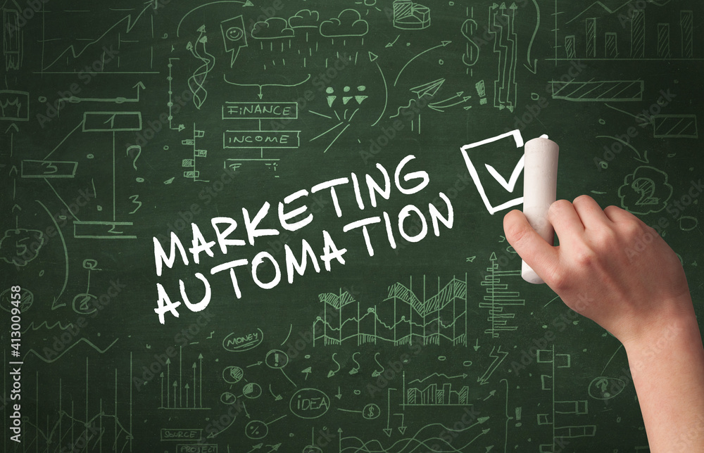 Hand drawing MARKETING AUTOMATION inscription with white chalk on blackboard, new business concept Hand drawing MARKETING AUTOMATION inscription with white chalk on blackboard, new business concept