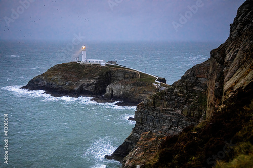 A lighthouse on South Stack, an island situated just off Holy Island on the northwest coast of Anglesey in Wales photo